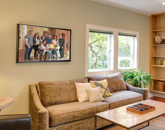 family painting from photo displayed on wall